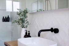a white rounded square vessel sink is a beautiful and chic touch to the bathroom and it makes it look more exquisite