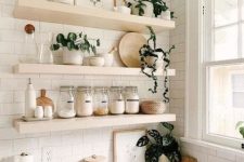 light-stained thick floating shelves are great for a farmhouse space, they can be used for both storage and displaying