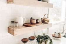 thick wooden floating shelves like these ones will add a farmhouse feel to the space and will make a statement