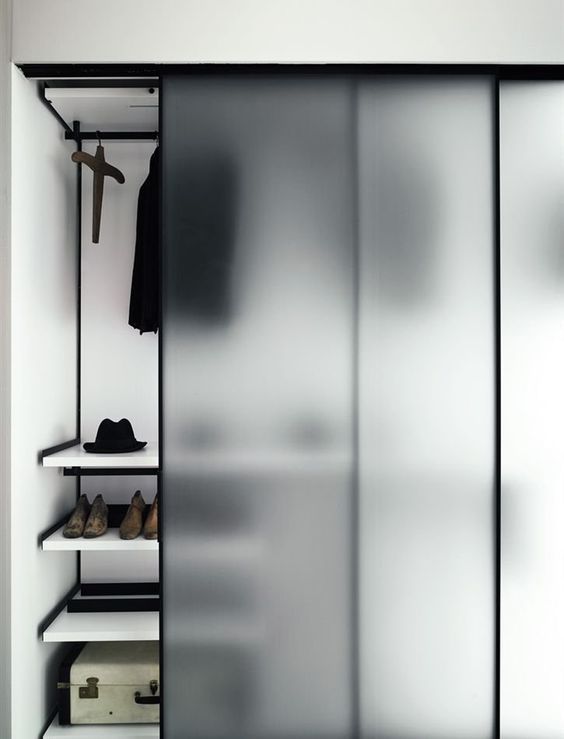 cover your closet with frosted sliding doors to make it hidden but to avoid a builky closet look in your bedroom