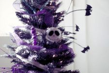 05 a purple Halloween tree with matching ribbons, Jack Skellington head, bats and lights is a gorgeous idea to rock at Halloween