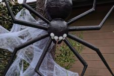06 a giant black spider with realistic spiderweb is a stylish and scary idea to decorate your outdoor or even indoor space and it wows