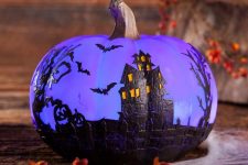 07 a beautiful painted purple pumpkin with a Halloween scene is a gorgeous decoration for Halloween