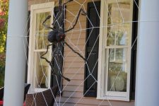 10 decorate your front porch with a giant spiderweb and a black spider and you will get a Halloween porch at once, without additional decor