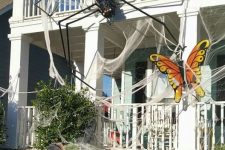 13 spiderweb, an oversized spider, a bold butterfly for styling a house for Halloween is a great idea to rock