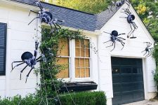 16 giant black spiders with a touch of fluff and spiderweb are great for styling your home outdoors, attach them to the walls and ground