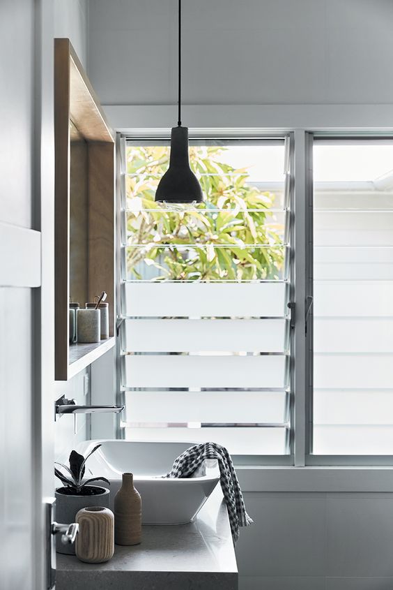 frosted glass windows like these ones are a nice idea for a bathroom when you want to keep privacy but still want natural light in the space