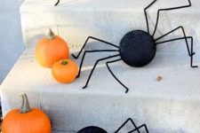 17 orange pumpkins and black round spiders with legs are fun and playful and are very easy to make yourself
