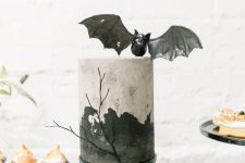 28 a stylish painted Halloween cake topped with a pretty black bat is a gorgeous solution to go for