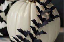 a stylish diy white pumpkin with bats