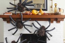 31 fluffy yet scary giant spiders covering the fireplace will make your living room feel like Halloween at once and will frighten some guests