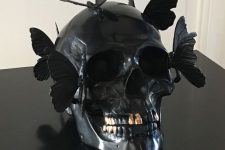 a black skull decorated with butterflies is a gorgeous and very creative Halloween decoration and looks veyr eye-catchy