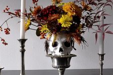 a cool tall halloween centerpiece with a skull
