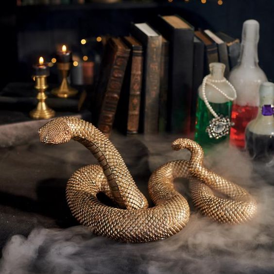 a gold resin snake with a textured metallic gold finish is a lovely idea for Halloween decor and it looks refined