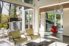 a light-filled mid-century modern space with glazed walls and clerestory windows that fill the spaces with natural light