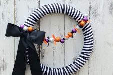 a black and white halloween wreath for a front door decor