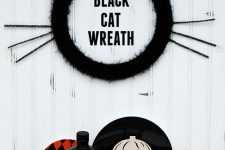 an easy and cute black cat wreath with cat ears and whiskers is a fun and lovely idea for Halloween
