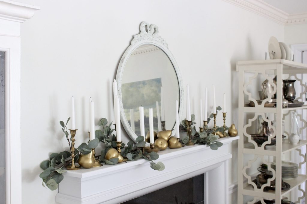 an eucalyptus garland is perfect to decorate a mantel for fall