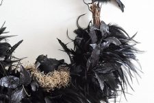 an out of the box Halloween wreath showing a raven nest is a lovely idea, use faux blackbirds and feathers to construct one