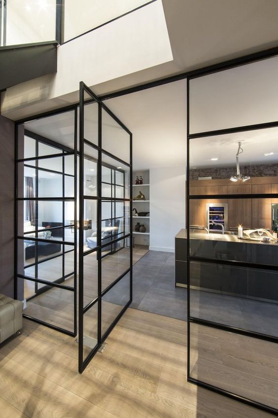 black metal French doors throughout the house to interconnect the spaces but do it in a delicate and gentle way
