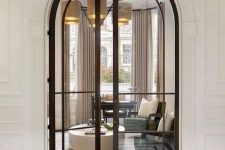 refined black metal frame double-height arched doors will highlight your sophisticated and super chic design and add style to it