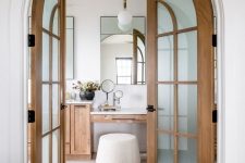 rich-stained wood frame and frosted glass arched double doors will elevate the style of any space and make it chic