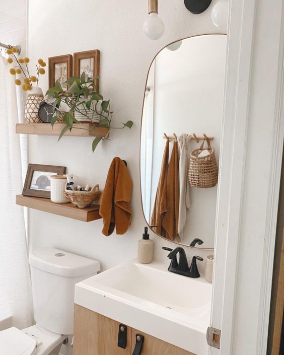rust-colored towels, billy balls in a vase will easily and effortlessly give your bathroom a cool fall look and you won't need to do a lot with them