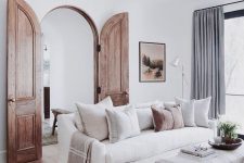 stained arched wooden doors like these ones can hint on the historical past of the house and you can preserve the existing ones