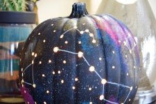 03 a galaxy pumpkin is a trendy idea for those of your who enjoy celestial Halloween decor and want something special