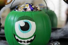 07 a green pumpkin monster filled with candies is inspired by Monster Corporation and looks super cool
