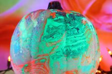08 a green, orange and pink marbleized pumpkin is a gorgeous decoration for Halloween that doesn’t require any carving