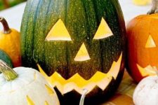 10 a stylish and classic Halloween pumpkin – a naturally green one turned into a jack-o-lantern for table styling