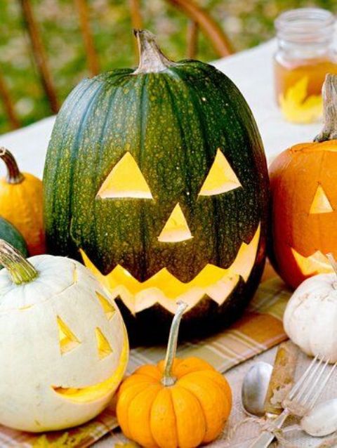 a stylish and classic Halloween pumpkin - a naturally green one turned into a jack-o-lantern for table styling