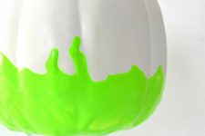 11 a white pumpkin with neon green touches is a gorgeous idea for modern and bold Halloween decor or just for the fall