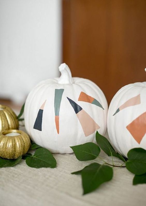 white pumpkins decorated with bold color block candy corns are great for delicate Halloween decor