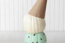 12 a couple of pumpkins attached to each other, painted and topped with a cardboard cone to show off a melting ice cream cone