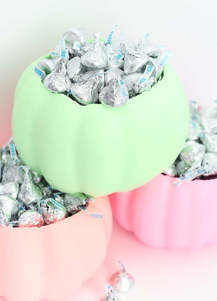 neon green, pink and blush pumpkin candy bowls are what you need to serve candies and other sweets at Halloween