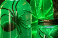 16 creepy Halloween specimen jars that glow brightly in the dark and contain giant spiders will be a nice prop for both a kid and an adult party