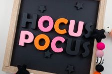 17 a Hocus Pocus Halloween wall decoration with colorful letters including pink ones is a fun idea for both a kid and an adult party