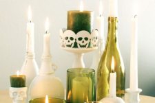 18 an extremely elegant Halloween centerpiece or decoration of green candleholders, bottles and candles paired up with white ones