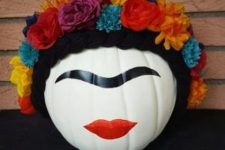25 a painted pumpkin showing off Frida Kahlo with her bold makeup and a colorful floral crown