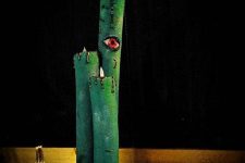 26 a scary Halloween decoration of green pool noodles turned into candles with blood and eyes is a gorgeous and easy DIY idea