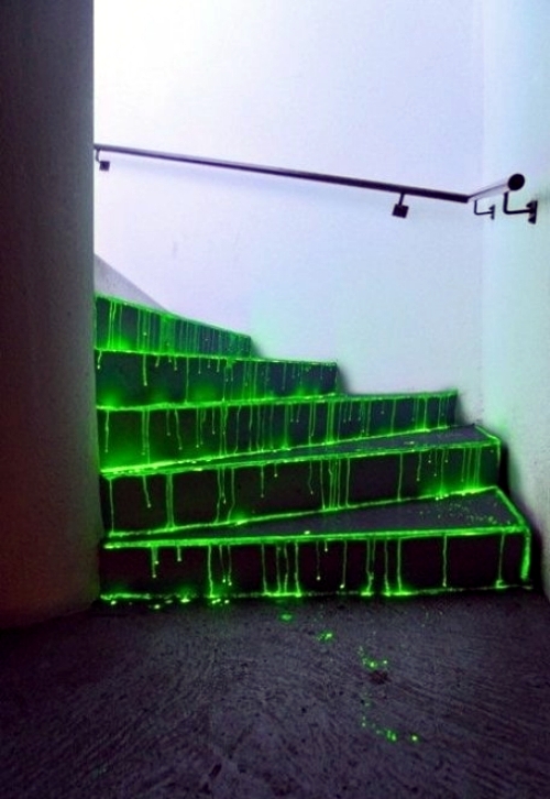 a staircase featuring neon green dripping looks very unusual and will definitely add to your Halloween styling