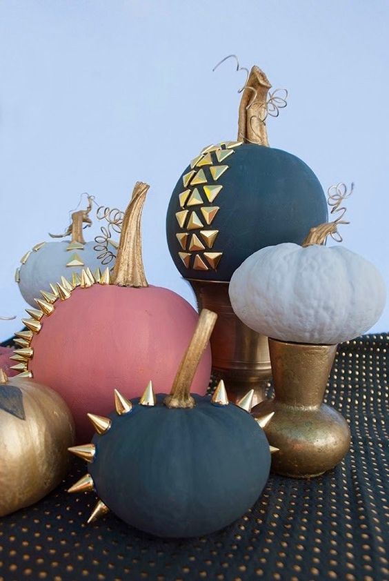 beautiful matte pumpkins in black, grey, coral pink and gold decorated with gold spikes and studs are amazing for Halloween
