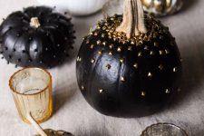 33 black and white pumpkins decorated with gold studs and black beads are amazing for Halloween