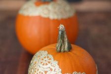 37 pumpkins decorated with gold lace doilies are glam, chic and beautiful and will work perfect for Halloween