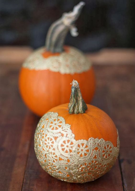 pumpkins decorated with gold lace doilies are glam, chic and beautiful and will work perfect for Halloween