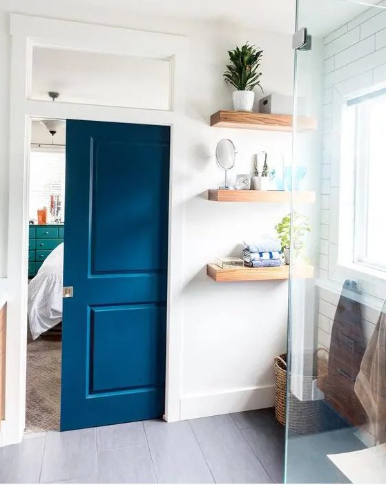 a bold blue pocket doors with panes is an elegant way to add color and separate the spaces in a bold and statement way