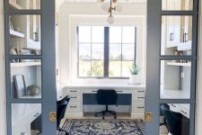 a modern farmhouse home office with grey French pocket doors and stylish white farmhouse furniture is chic