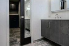 a modern farmhouse space with a mirror pocket door in a dark stained frame is a cool idea, you won’t need another mirror
